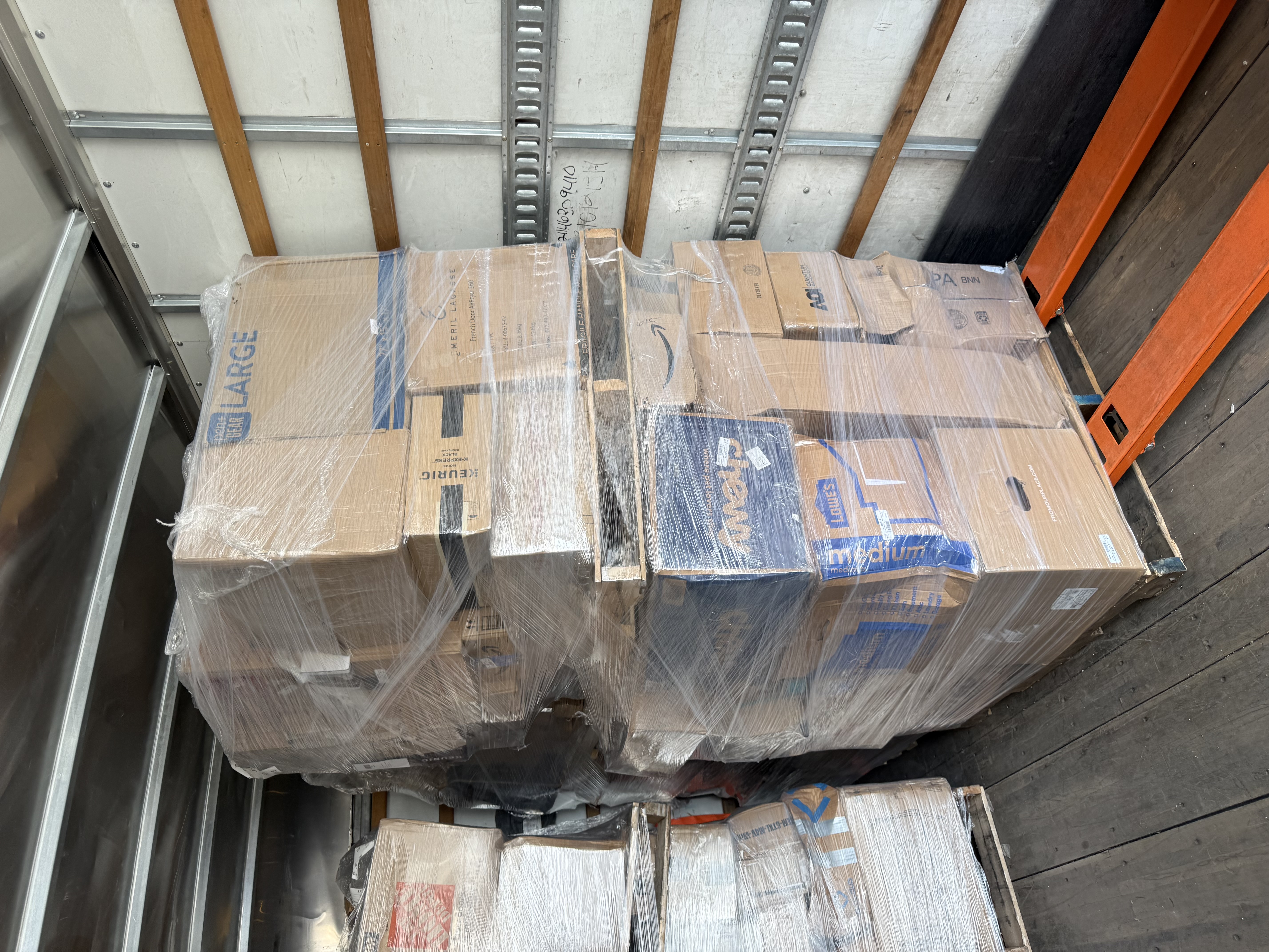 Wrapped palletized business deliveries inside a MaxxLift truck