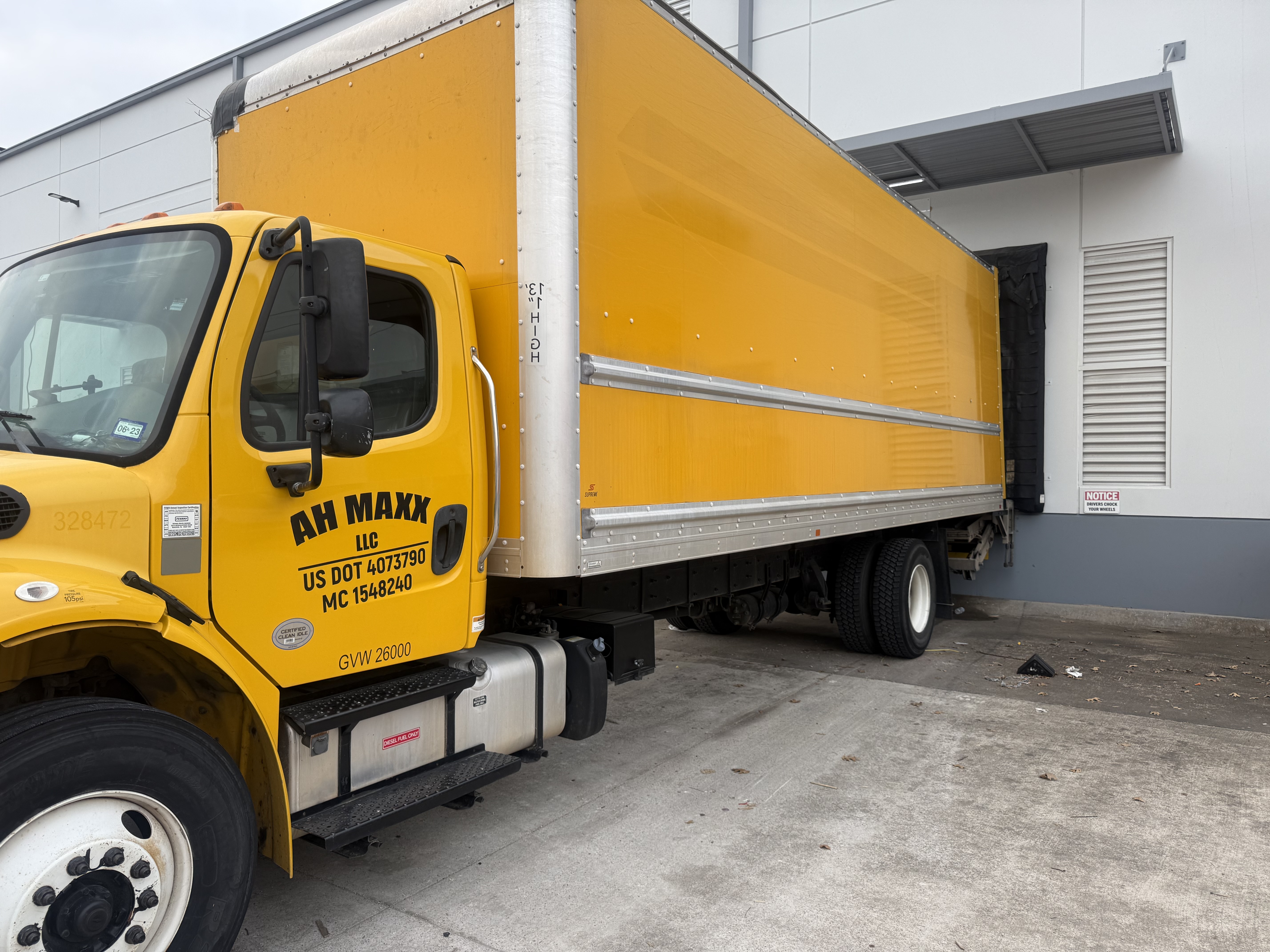 MaxxLift Logistics 26ft box truck at a commercial loading dock